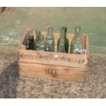 Various vintage bottles in Hull crate