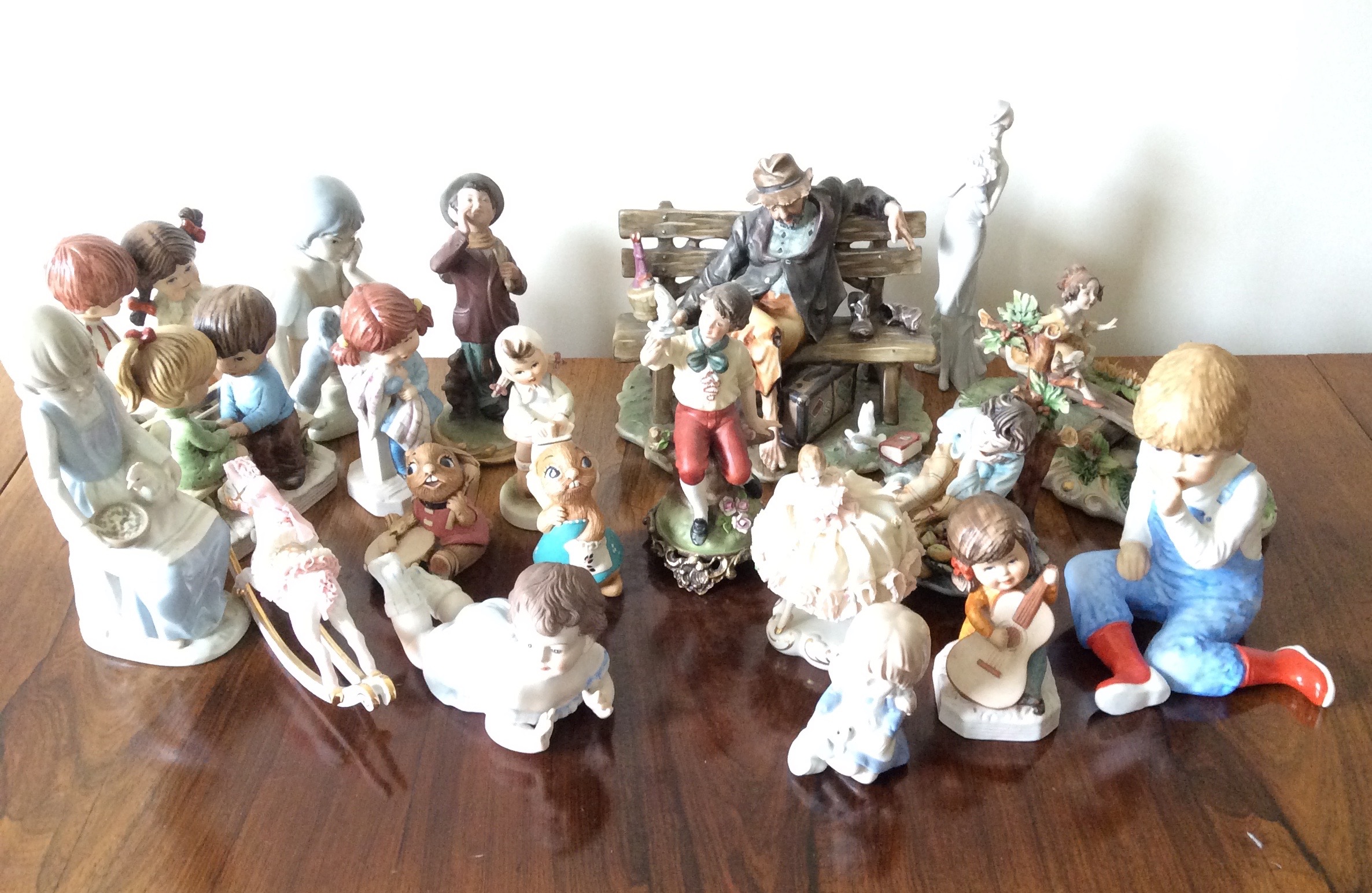 A collection of figurines inc. Capodimonte etc.