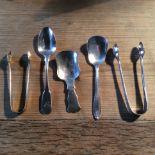 Two silver tongs and two silver teaspoons, 3.2ozs.