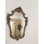 Cartouche shaped gilt mirror