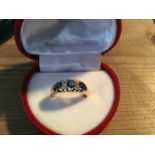 An 18ct gold sapphire and diamond ring size M