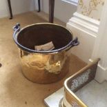 Brass cauldron with iron handles