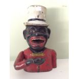 Tin plate money bank with top hat stamped to back