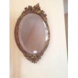 Small oval gilt mirror