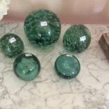 Five various green glass Castleford dump door stops