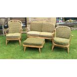 A good quality Ercol suite inc. two seater sofa  , his and hers easy chairs and a stool with