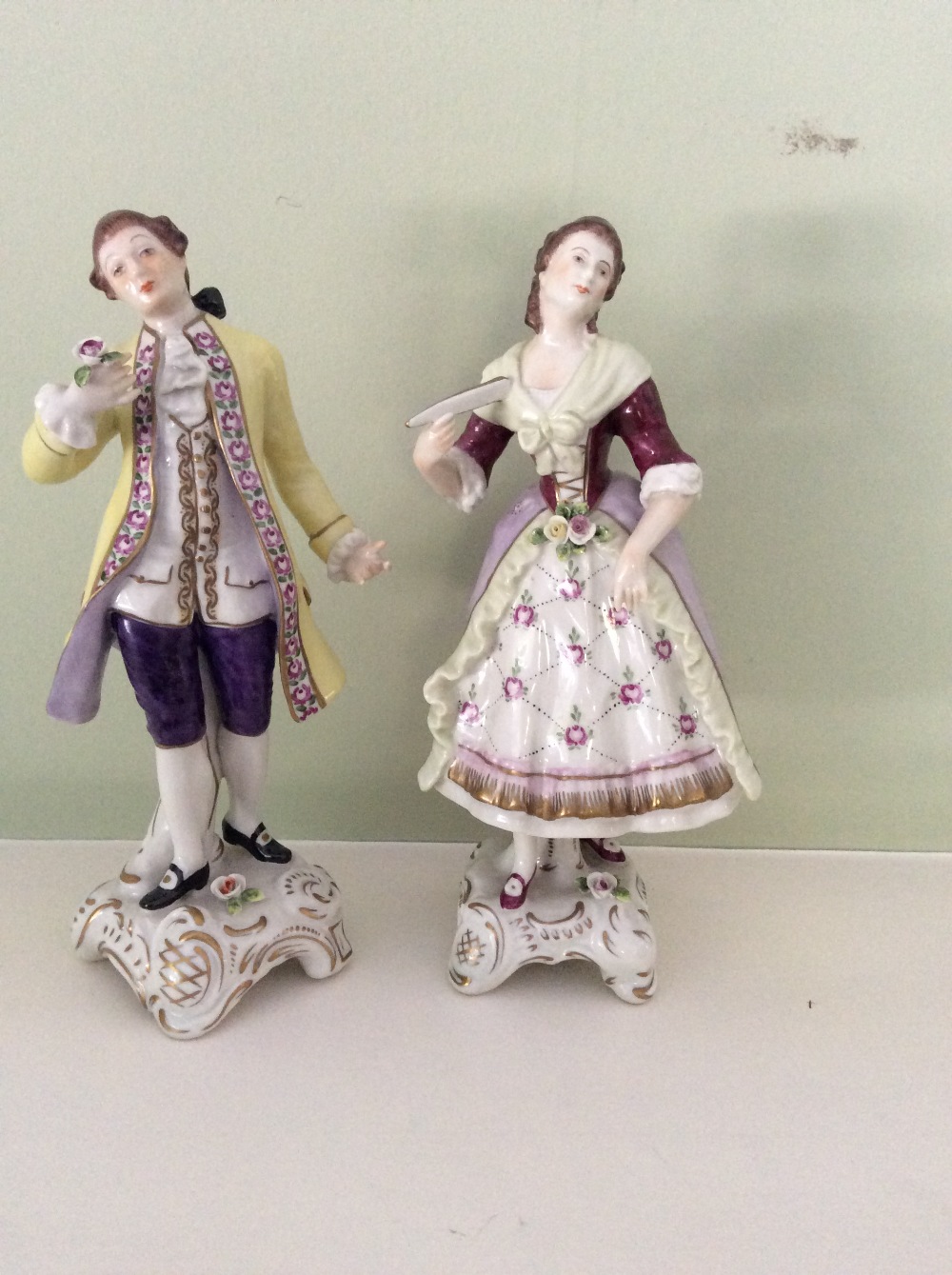 Pair continental porcelain figures a lady and gentleman