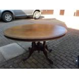 Victorian mahogany oval tip top table with quatrefoil base