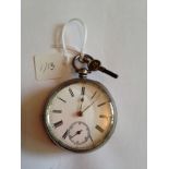 Silver pocket watch and key