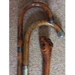 Three walking sticks inc. silver mounted and carved dogs head