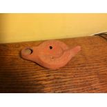 Roman redware oil lamp from Tunisia 3-5th AD decorated with pouncing lion