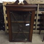 A 19th c mahogany hanging corner cupboard with glazed door