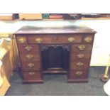 Fine quality 18th c knee hole desk with original fire gilt rococo handles and finely carved arch