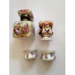 Four porcelain inkwells inc. two Dresden