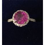 Sapphire and diamond ring a"Hot Pink" central sapphire of 2.56 cts 18 ct white gold band size M