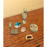 Seven small ancient atefacts inc. Amulet of Bes,small ushabti, two scarabs and an eye of Horos etc