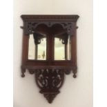 Edwardian mahogany corner shelf with bevelled glass mirror