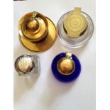 Three glass and brass inkwells and one plated