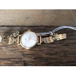 An 18ct gold ladies watch by Bucheron on rolled gold bracelet