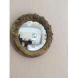 Small circular gilt wall mirror