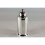 An Art Deco silver sugar caster, cylindrical faceted form with screw top, maker Mappin & Webb,