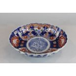 An early 20th century Imari oval dish decorated in the traditional colours (a/f), 24.5cm by 20cm