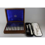 A set of twelve Mappin and Webb plated and mother of pearl handled dessert knives and forks in case,