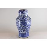 A Chinese blue and white porcelain vase and cover, baluster shape with two dragons and pearl to