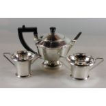 A three-piece silver tea set, maker ALD Birmingham 1936, comprising teapot, sugar bowl and cream