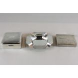 A silver ashtray with machine turned decoration, together with a wood lined silver cigarette box and