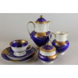 A German porcelain coffee set, of five cups and six saucers, side plates, coffee pot, jug and