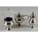 A heavy silver three-piece condiment set of mustard, salt and pepper, maker CJV Ltd Sheffield