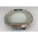 A plain silver circular salver, maker Sebastian Henry Garrard London 1922, with pie crust border