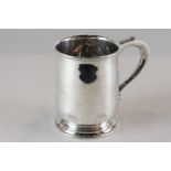 A silver mug, maker CE London 1946, with scroll handle (presented), 6oz