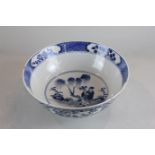 A 19th century Chinese blue and white circular porcelain bowl decorated with sage in garden and