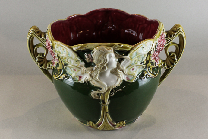 A French Frie Onnaing Art Nouveau Majolica jardiniere decorated with a winged profile of a lady with