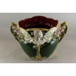 A French Frie Onnaing Art Nouveau Majolica jardiniere decorated with a winged profile of a lady with