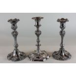 A pair of silver plated baluster shaped candlesticks with scroll decoration, 25cm, and another