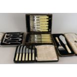 A cased set of six pairs of silver plated fish knives and forks; a cased pair of fish servers;