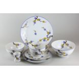 A Limoges porcelain part tea service comprising six cups, saucers, side plates, two bowls, two