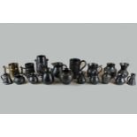 A Prinknash pottery collection of mugs, jugs and vases (18) finished in black glaze
