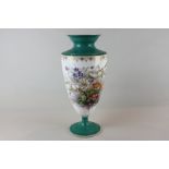A French porcelain vase decorated with summer flowers in bright colours with green flared rim and
