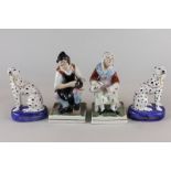 A pair of Staffordshire ornaments, cobbler and his wife, 17cm high, and a pair of Staffordshire