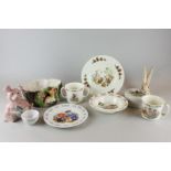 A Bunnykins nursery breakfast set, a Coalport Postman Pat plate and a Wedgwood Peter Rabbit bowl,