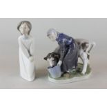 A Royal Copenhagen figure of a milkmaid with cow together with a Lladro figure of a girl in a