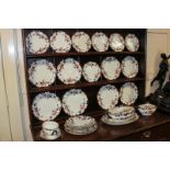 A Staffordshire pottery part dinner service with eight dinner, dessert and side plates, two small