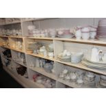 A very large collection of various white china to include serving platters, teapots, jugs, bowls,