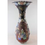 A large 19th century Japanese porcelain vase decorated in colours, with floral and figure panels,