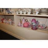 A collection of various pink and white tea ware to include a part coffee set decorated with