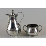 A Victorian silver hot water jug, maker Rupert Favell London 1881, with pear shaped body and